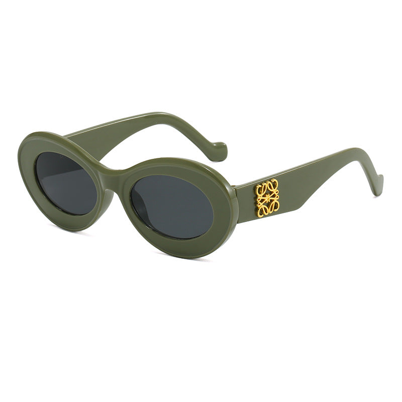Women's fashionable sunglasses with oval frame and golden applications Stornfield