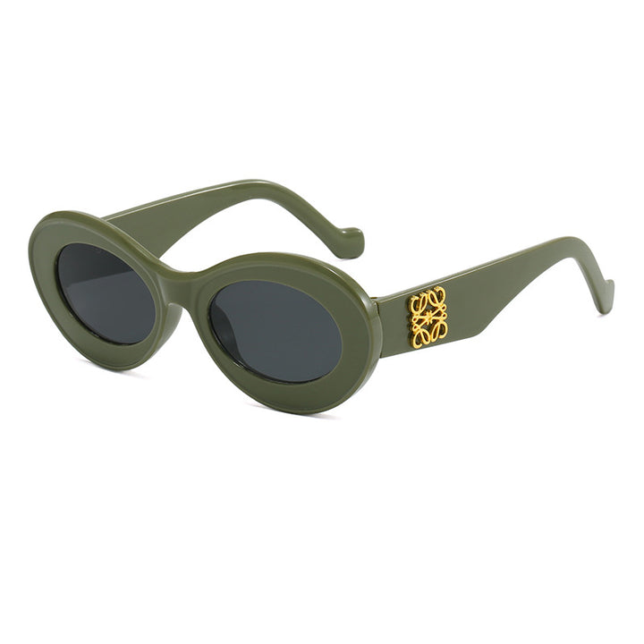 Women's fashionable sunglasses with oval frame and golden applications Stornfield