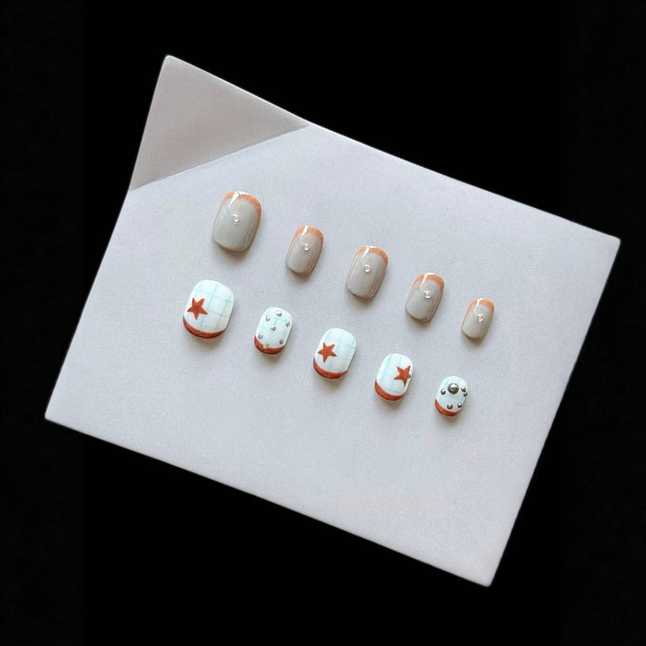 Artistic Press-On Nail Art Set with Star and Metallic Accents