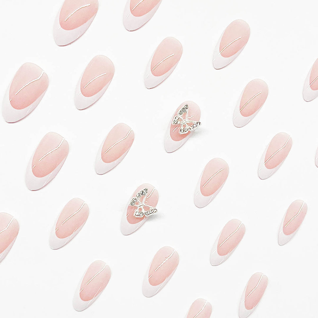 Artificial nail set with elegant French design and rhinestone-embellished accents Stornfield