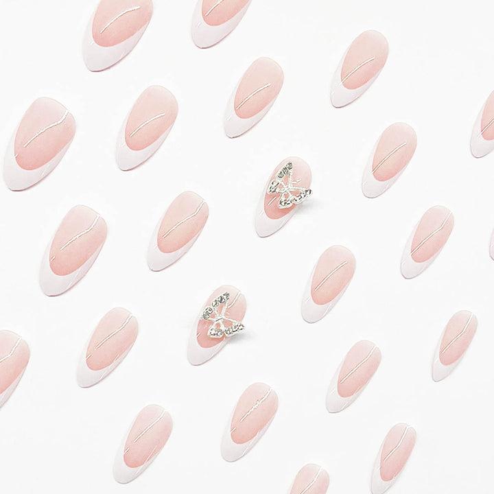 Artificial nail set with elegant French design and rhinestone-embellished accents Stornfield