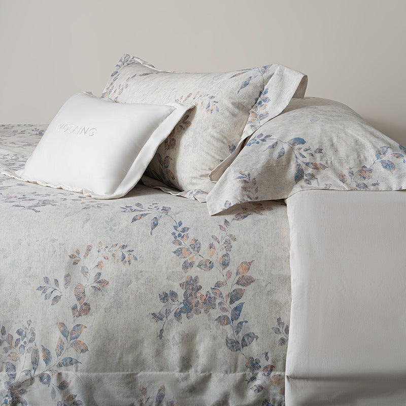 Linen-look cotton duvet cover set with delicate watercolor flower pattern and reversible function