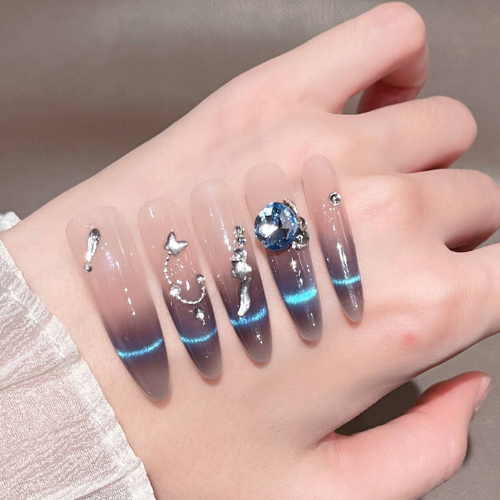 Artistic Stiletto Press-On Nail Art with Glimmering Accents Stornfield