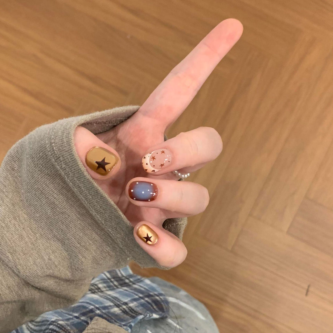 Artificial nails in modern design with star and gradient elements Stornfield