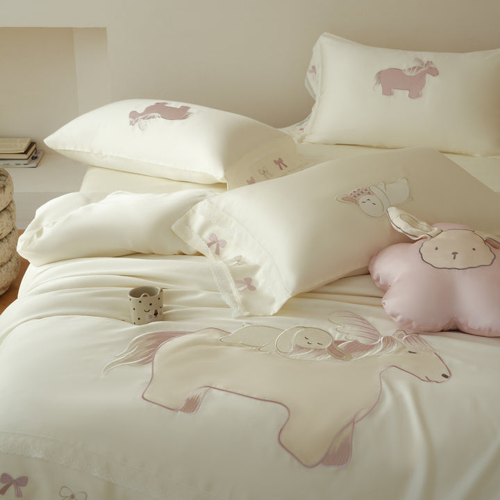 Child bedding set made of cotton satin with appliqués, ruffles, and cuddle pillow
