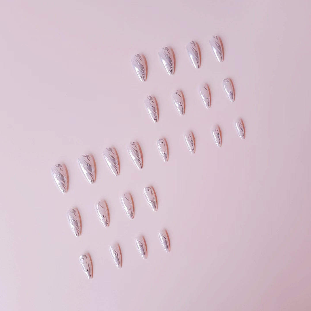 Nail set with elegant water drop design and 3D accents Stornfield