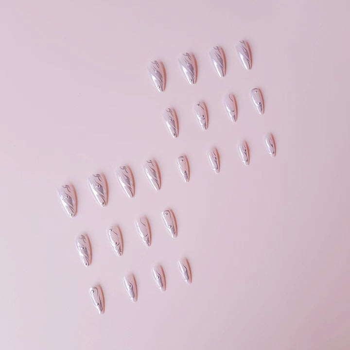 Nail set with elegant water drop design and 3D accents Stornfield