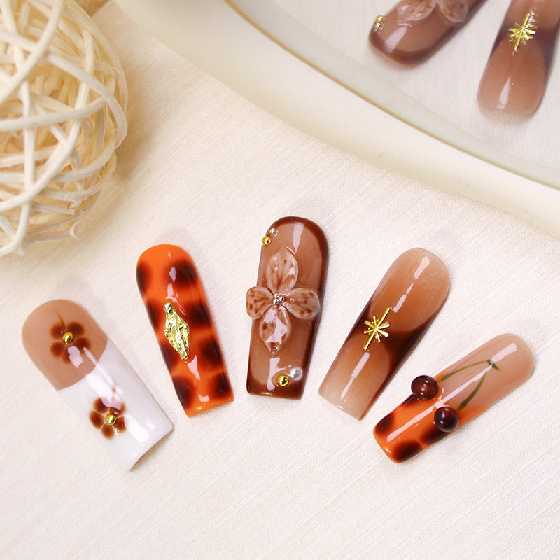 Acrylic nail set with luxurious decorations and stylish accents Stornfield