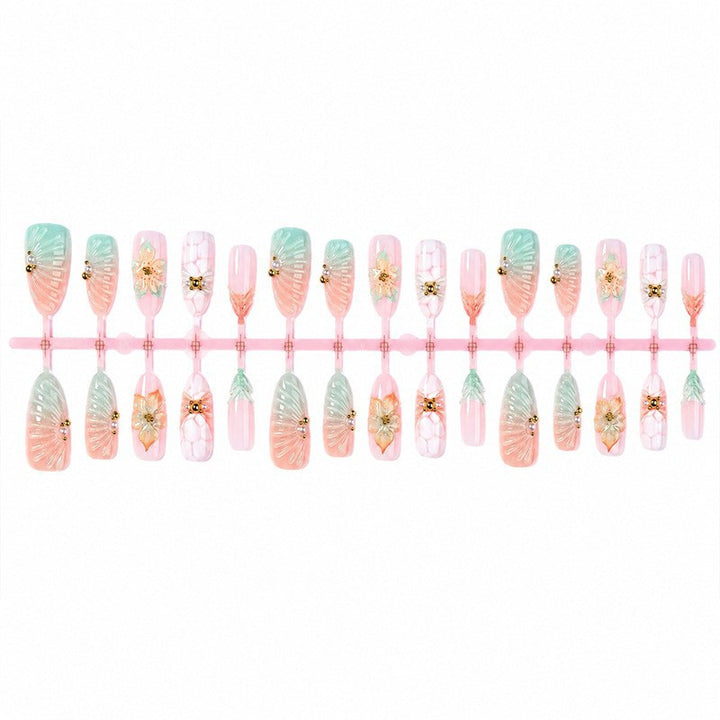 Artificial nail set with glamorous flower and glitter details Stornfield