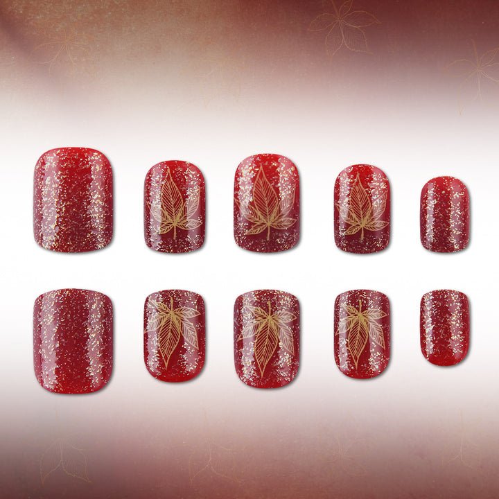 Artistic Leaf-Embellished Nail Art Design Stornfield