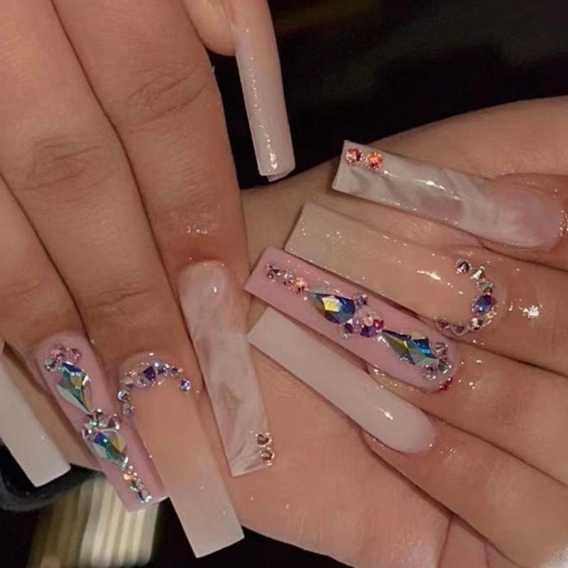 Glamorous artificial nails with gemstone embellishments Stornfield