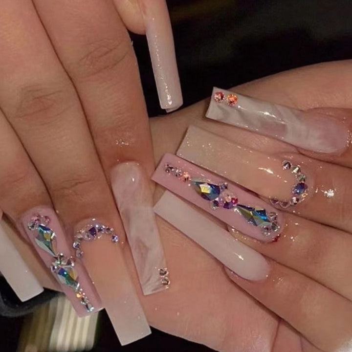 Glamorous artificial nails with gemstone embellishments Stornfield