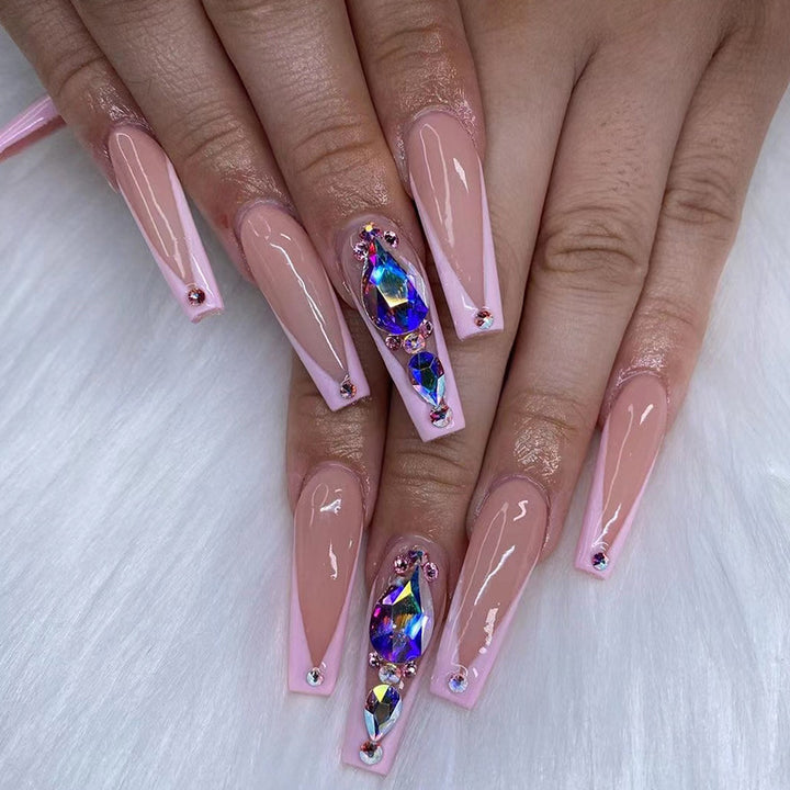 Artful nail extensions with rhinestone and flower accents Stornfield
