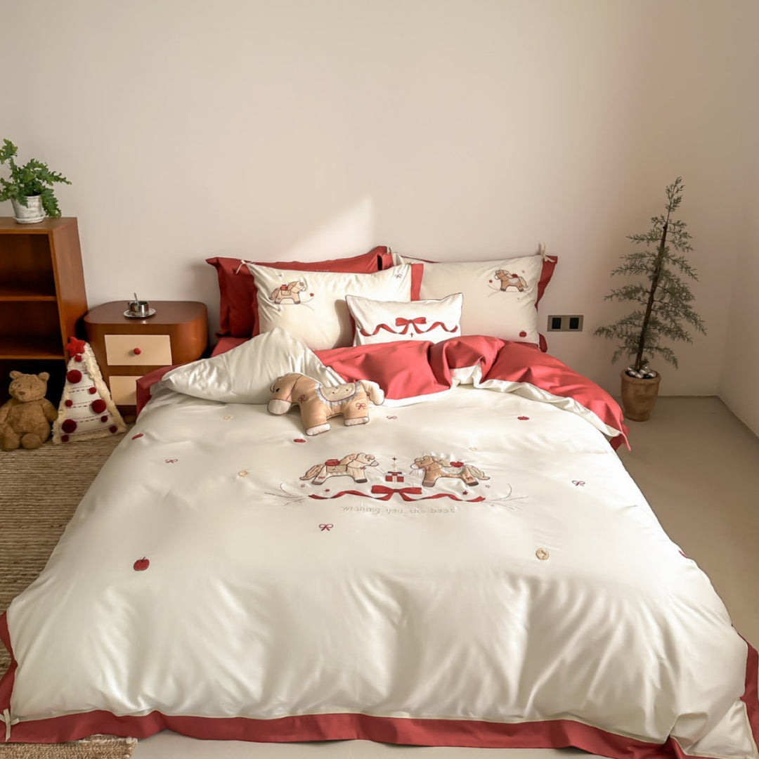 Satin bedding set with embroidered rocking horse motif