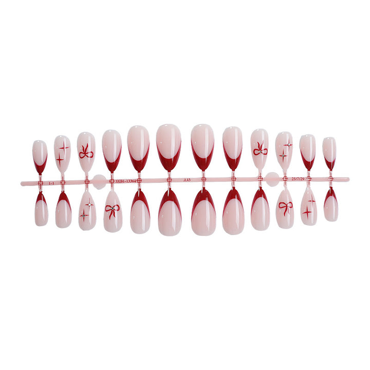 Creative artificial nail set with elegant bow and gradient design Stornfield