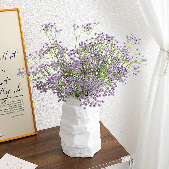Decorative artificial flower branch with fine purple flowers