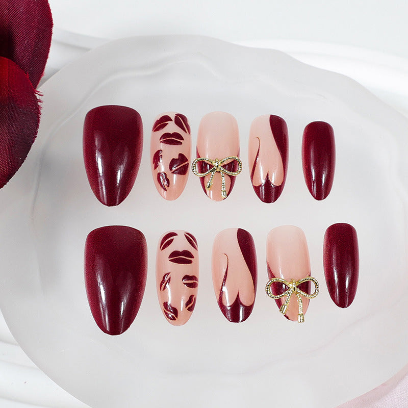 Artificial nail set with elegant bow and kiss mouth designs Stornfield