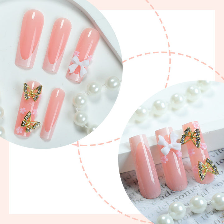 Artificial nail set with elegant butterfly and bow accents Stornfield