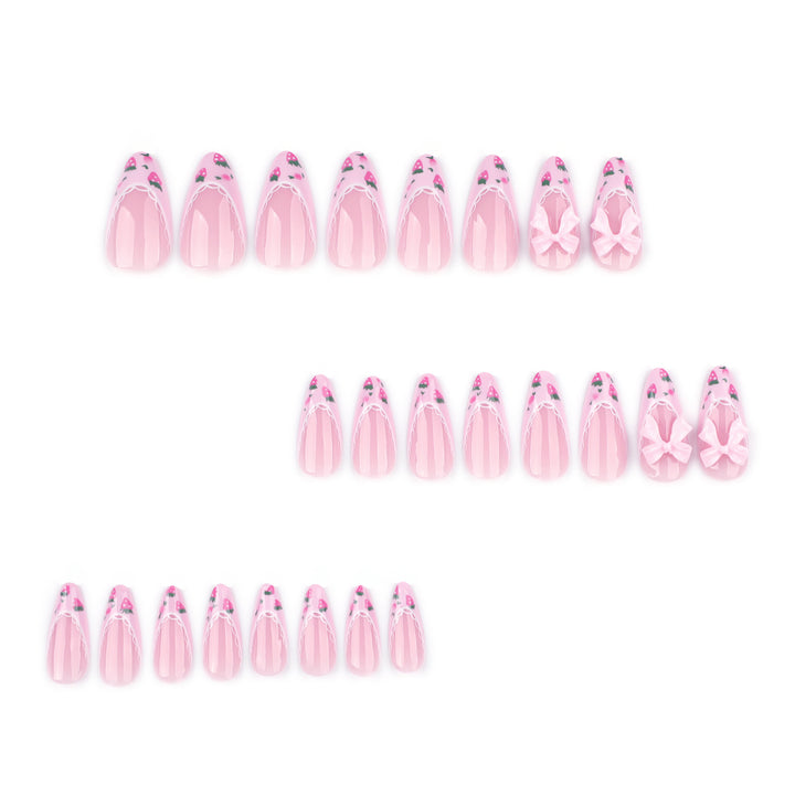 Artful stiletto nails with floral accents and bow embellishments Stornfield