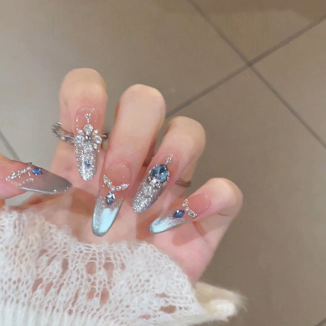 Glamorous artificial nails with sparkling rhinestone accents Stornfield