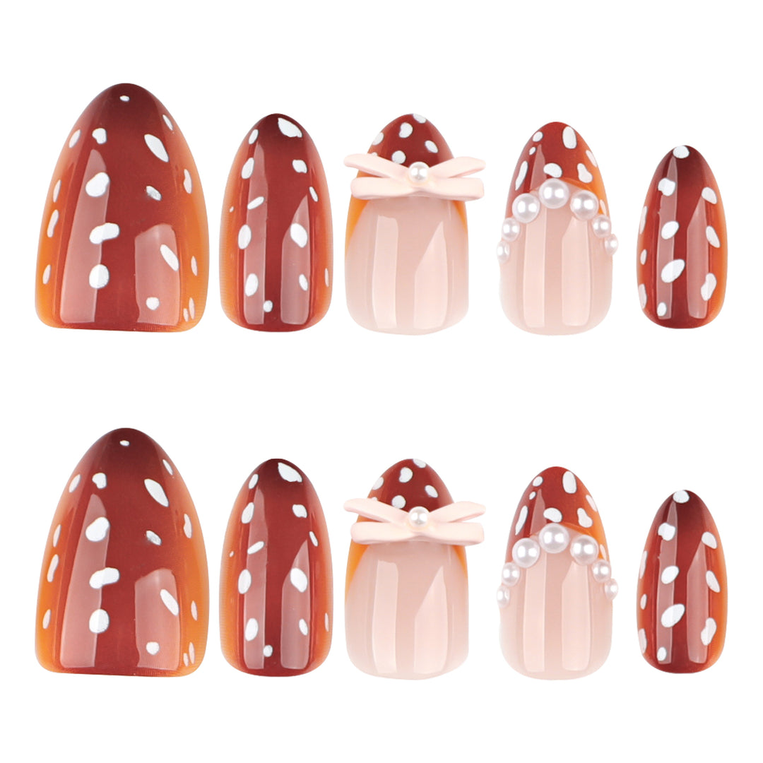 Artificial nail art with dot pattern and bow accents Stornfield