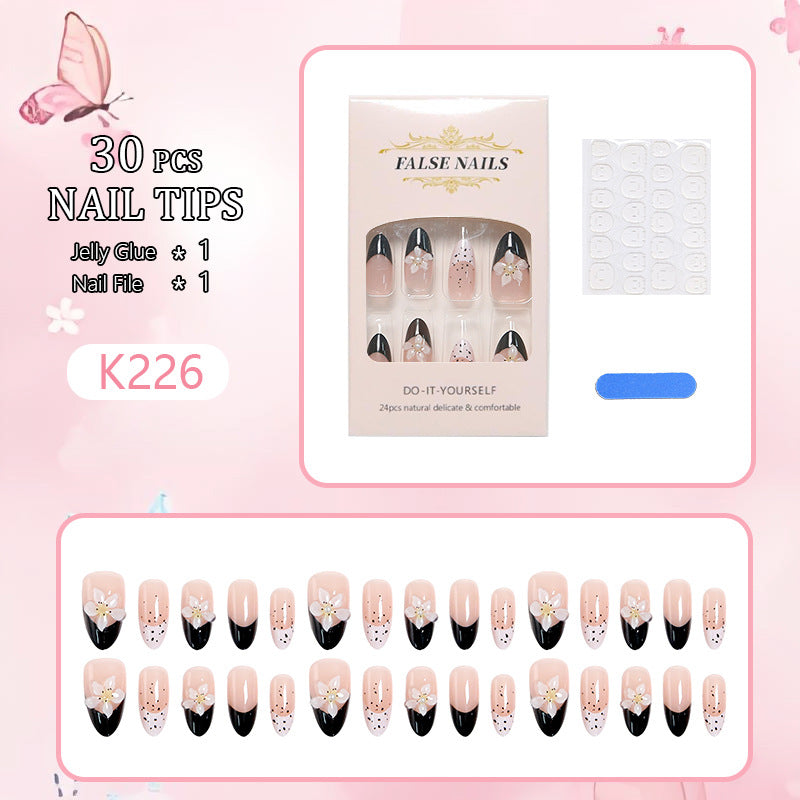 Artful nail tips with floral embellishments Stornfield