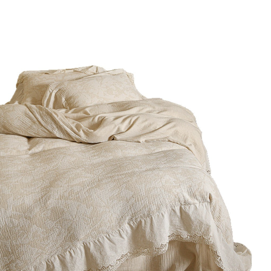 Vintage-inspired linen bedding set with subtle floral damask & ruffle