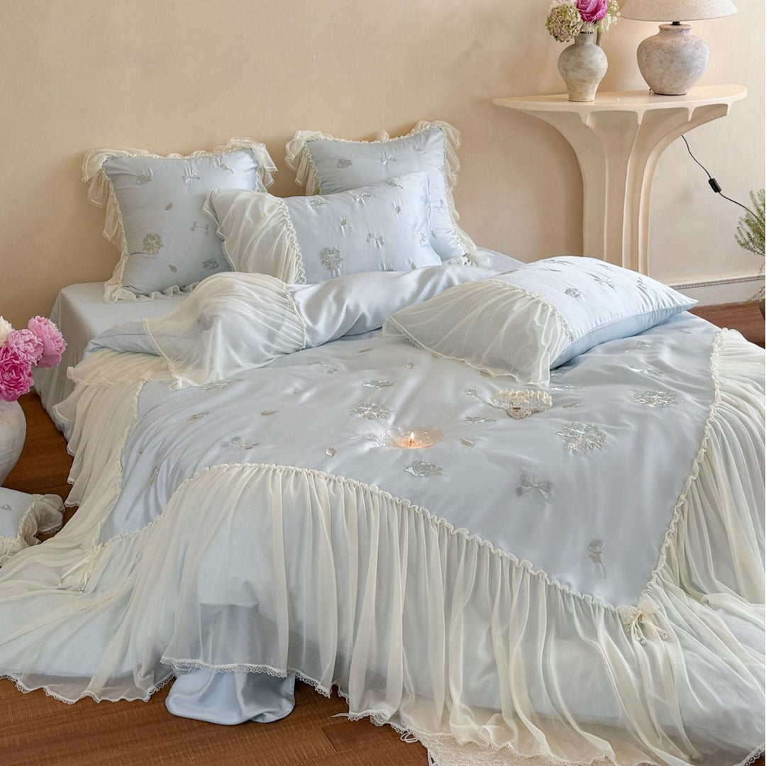 Romantic embroidered bedding set with ruffled frill and tulle overlay