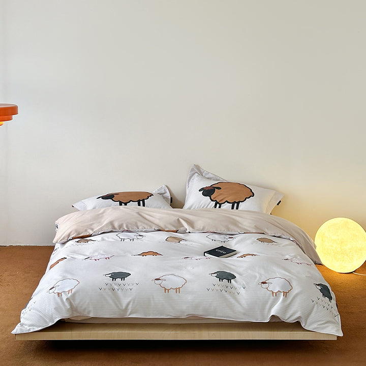 Reversible cotton bedding set with playful sheep print and soft jersey finish
