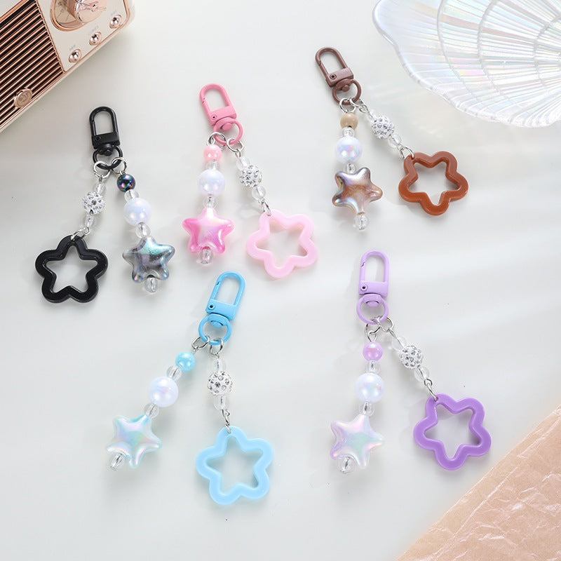 Playful keychain with floral and star motif Stornfield