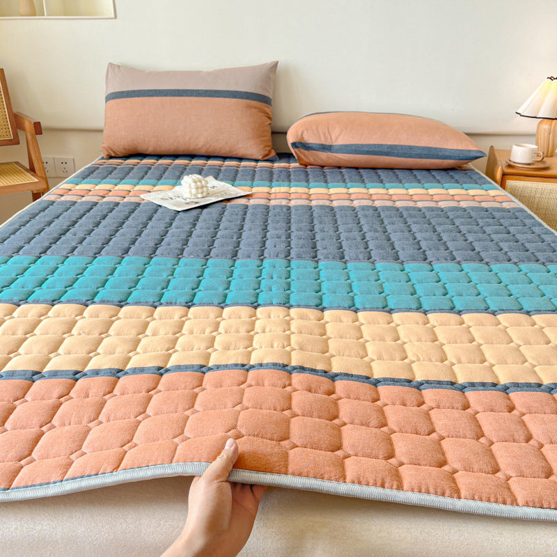 Padded mattress protector-topper with quilting and non-slip underside