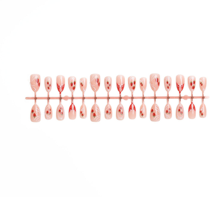 Artificial nail set with romantic strawberry and bow motifs Stornfield