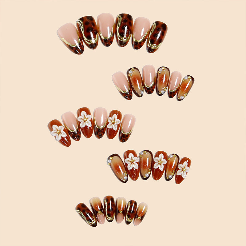 Elegant artificial nails with floral and animal motifs Stornfield