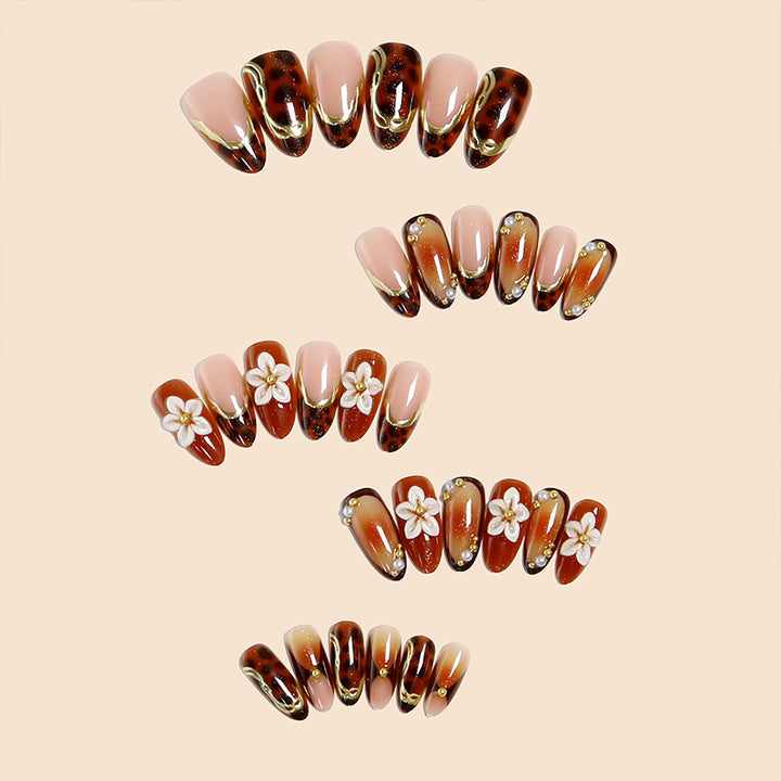 Elegant artificial nails with floral and animal motifs Stornfield