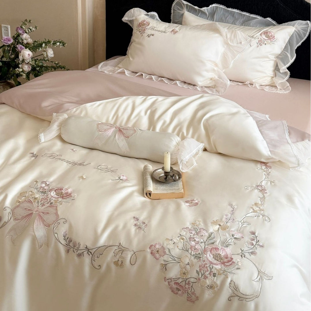 Embroidered satin bedding set with frill, ruffles, and decorative pillow