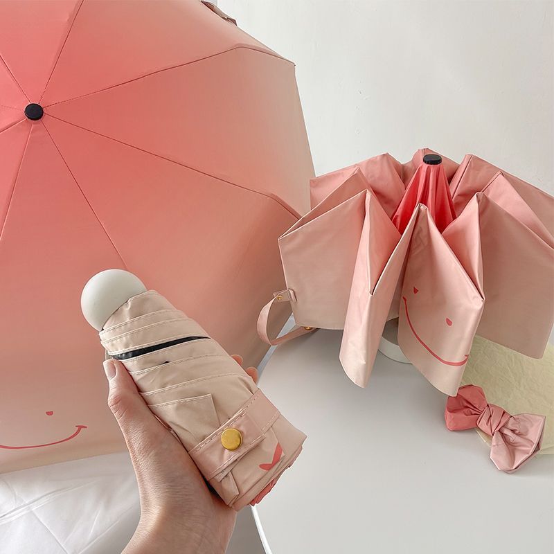Women's foldable umbrella with playful design and handy wooden handle Stornfield