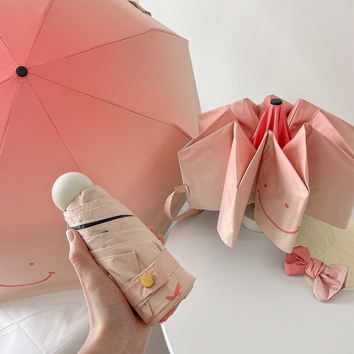 Women's foldable umbrella with playful design and handy wooden handle Stornfield