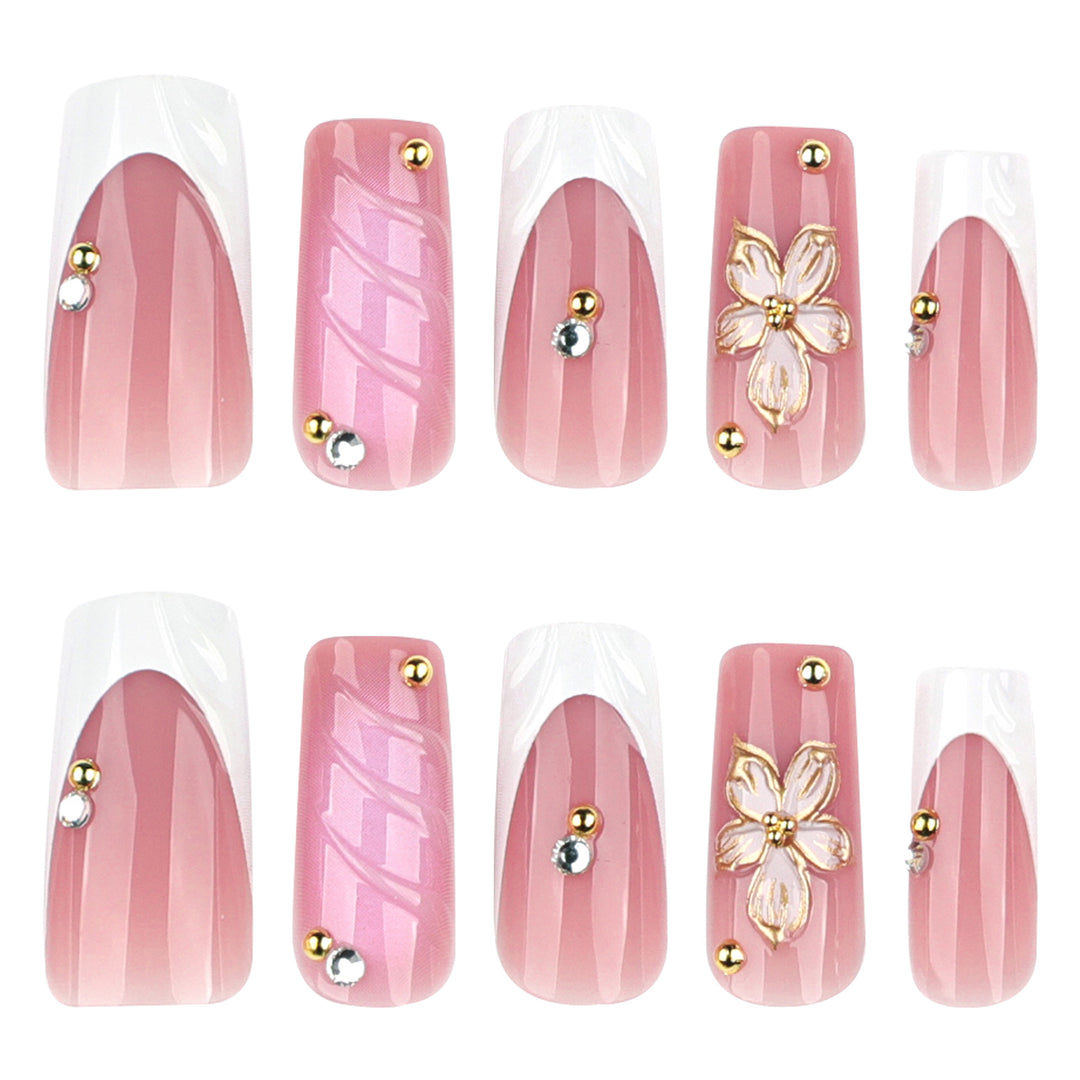 Glamorous gel nails with floral accent and glitter details Stornfield