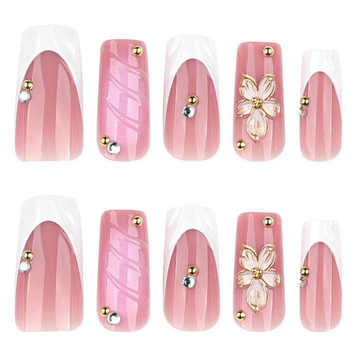 Glamorous gel nails with floral accent and glitter details Stornfield