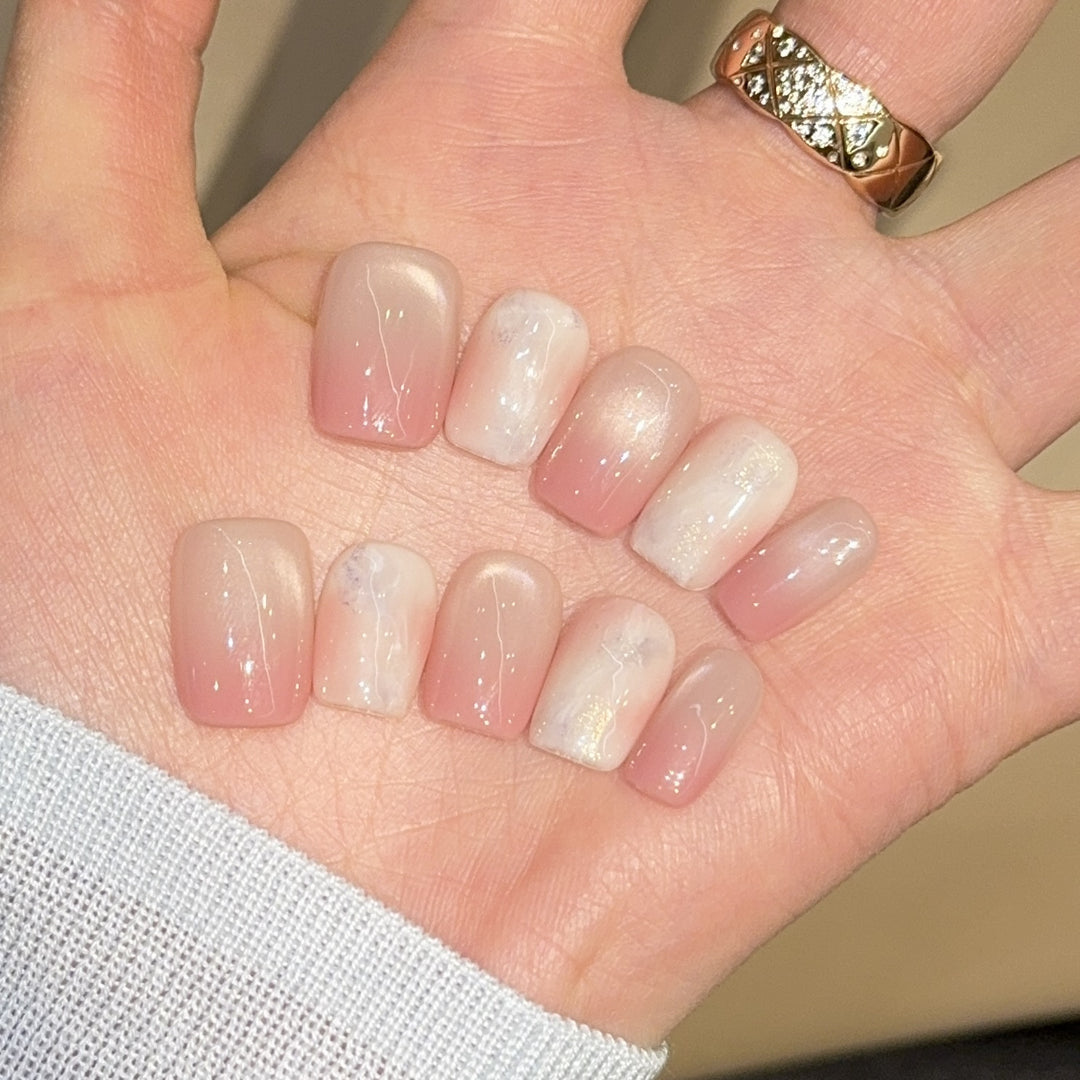 Artificial nails with elegant gradient colors and holographic accents Stornfield
