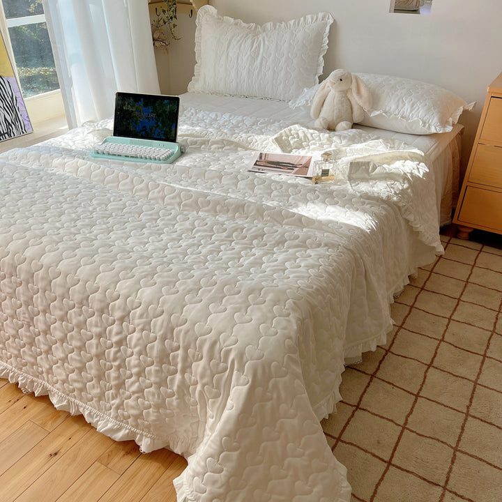 Quilted bedspread set with frill edge and heart quilting pattern