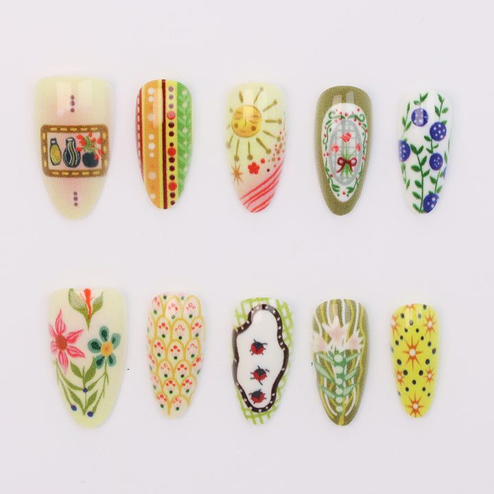 Nail art set with elaborate floral and colorful design Stornfield