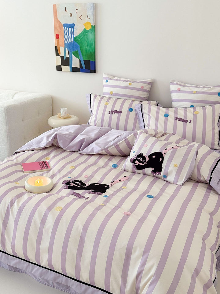 Playful cotton bedding set with embroidered bunny and cherry motif including decorative pillow