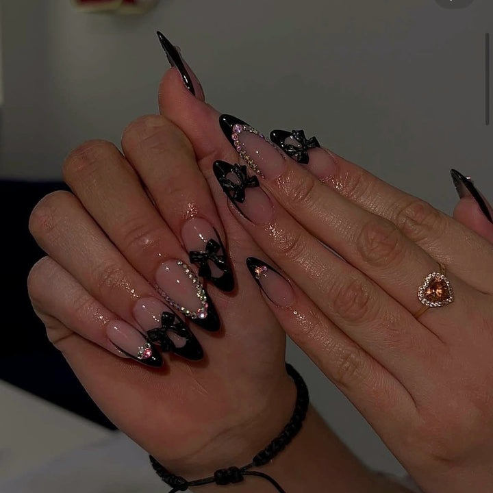 Artificial nail set with glamorous 3D bows and rhinestone embellishments Stornfield