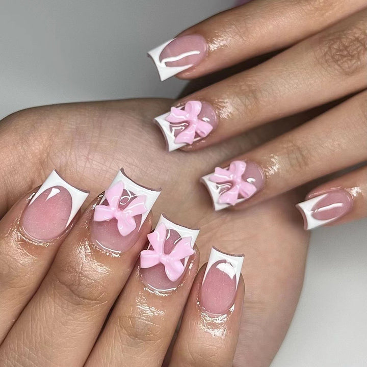 Artificial nails with cute bow designs Stornfield