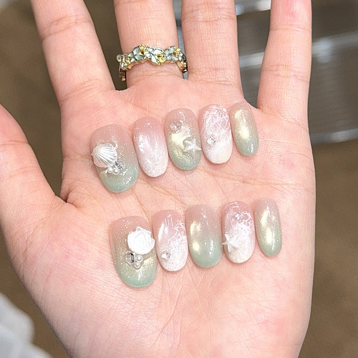 Artificial nail tips with maritime design and glitter effects Stornfield