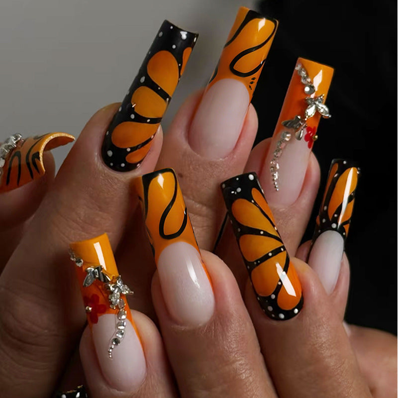 Creative nail set with shimmering floral and geometric designs Stornfield