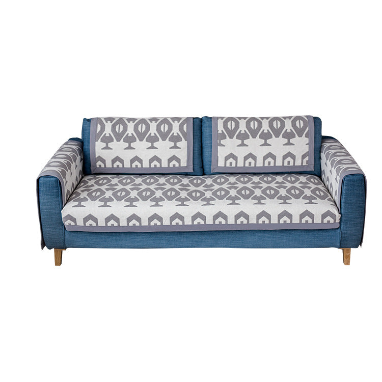 Universal sofa protective cover for three-seater with leaf print, non-slip underside and separate armrest covers Stornfield
