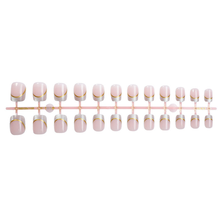 Artificial nail creations with elegant gold trim Stornfield