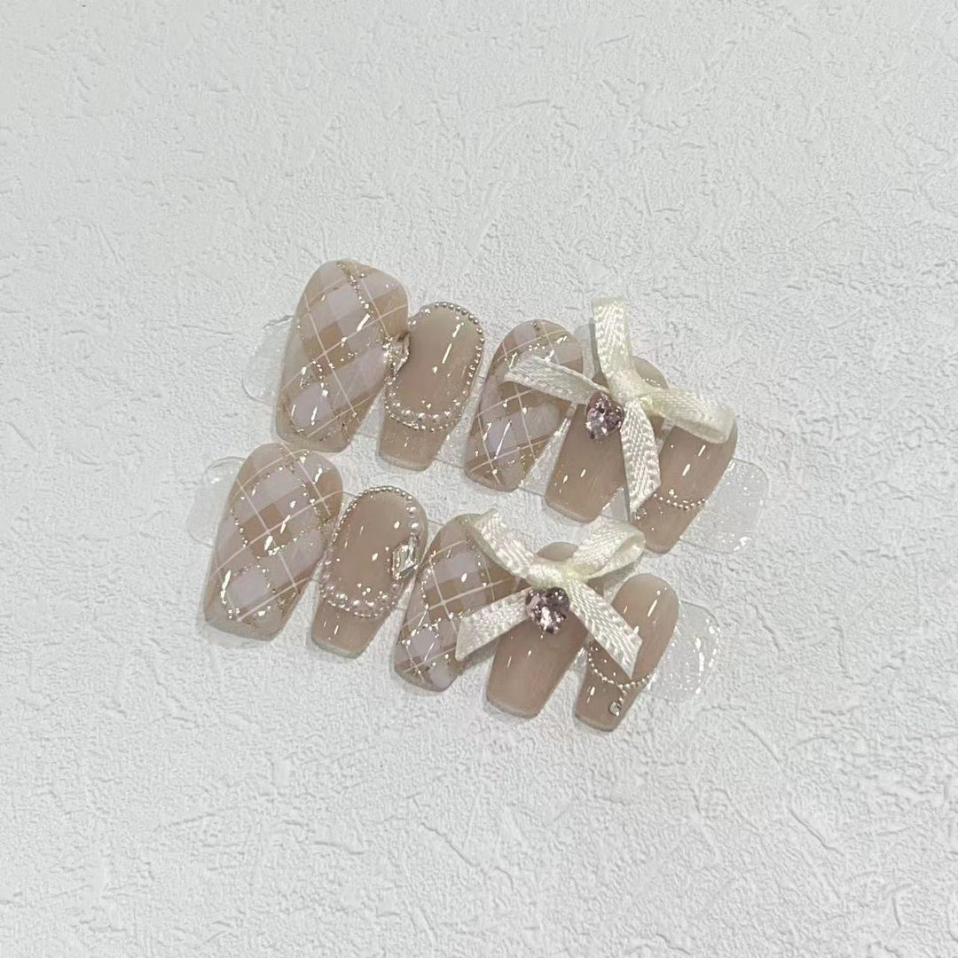 Elegant Press-On Nail Art Set with Ribbons and Gemstone Accents Stornfield